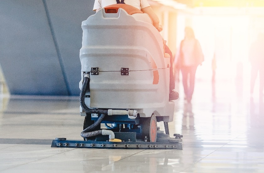 Close-up sweeper machine cleaning. Concept clean airport from debris